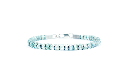 Beneka Aquamarine Bracelet – Natural Stone Clasp-Lock Bracelet featuring faceted disc-cut Aquamarine beads (2–3mm) with elegant gunmetal-finish spacers and clasp, handcrafted on premium elastic silicone cord. Luxury gemstone jewelry for calmness, clarity, and ocean-inspired style.
