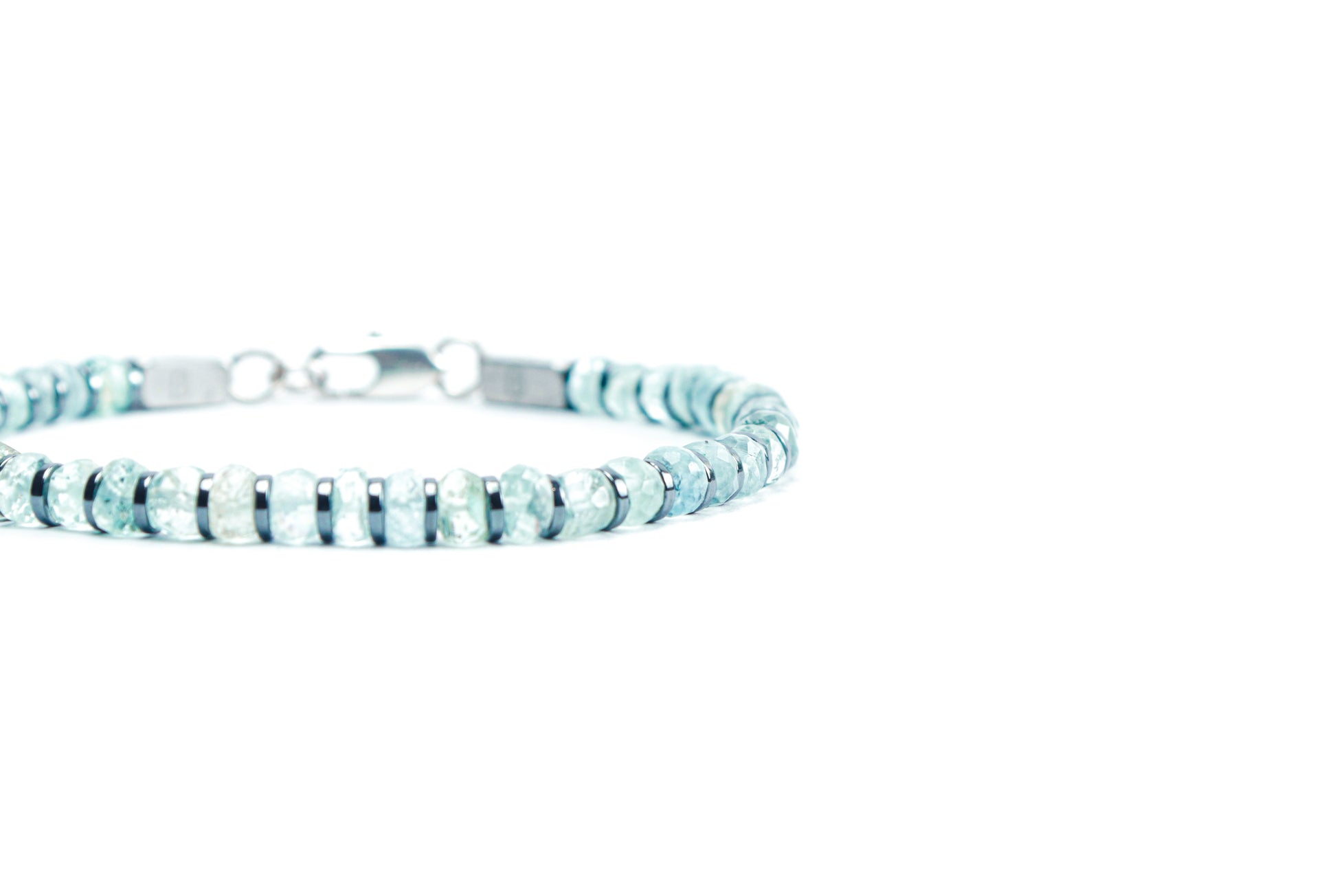 Beneka Aquamarine Bracelet – Natural Stone Clasp-Lock Bracelet featuring faceted disc-cut Aquamarine beads (2–3mm) with elegant gunmetal-finish spacers and clasp, handcrafted on premium elastic silicone cord. Luxury gemstone jewelry for calmness, clarity, and ocean-inspired style.