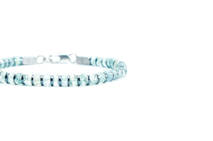 Beneka Aquamarine Bracelet – Natural Stone Clasp-Lock Bracelet featuring faceted disc-cut Aquamarine beads (2–3mm) with elegant gunmetal-finish spacers and clasp, handcrafted on premium elastic silicone cord. Luxury gemstone jewelry for calmness, clarity, and ocean-inspired style.
