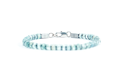 Beneka Aquamarine Bracelet – Natural Stone Clasp-Lock Bracelet featuring faceted disc-cut Aquamarine beads (2–3mm) with elegant gunmetal-finish spacers and clasp, handcrafted on premium elastic silicone cord. Luxury gemstone jewelry for calmness, clarity, and ocean-inspired style.