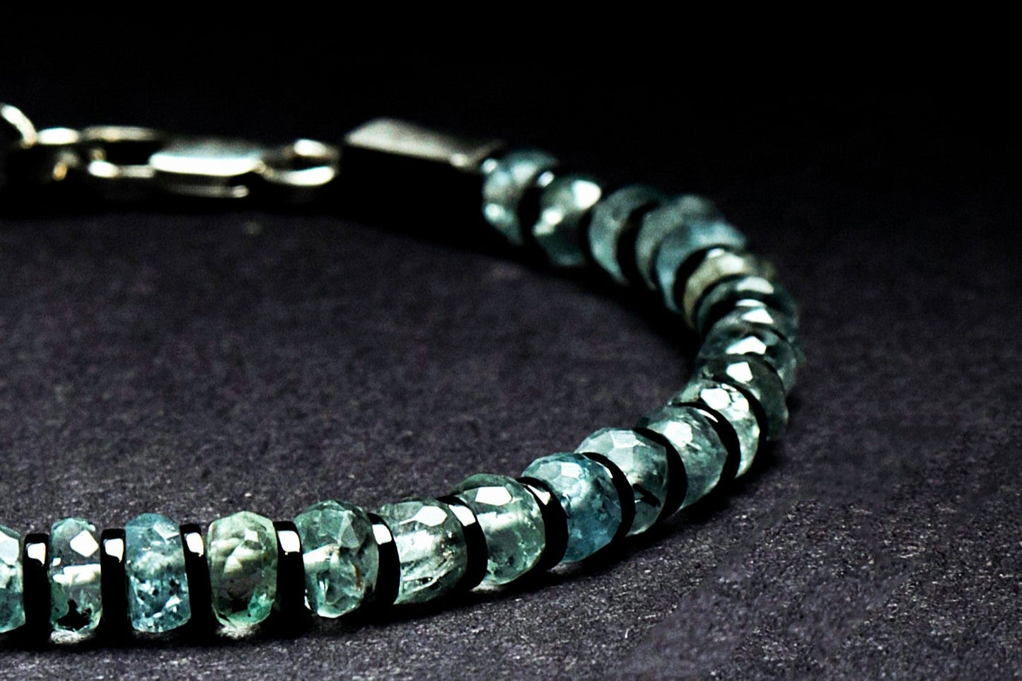 Beneka Aquamarine Bracelet – Natural Stone Clasp-Lock Bracelet featuring faceted disc-cut Aquamarine beads (2–3mm) with elegant gunmetal-finish spacers and clasp, handcrafted on premium elastic silicone cord. Luxury gemstone jewelry for calmness, clarity, and ocean-inspired style.