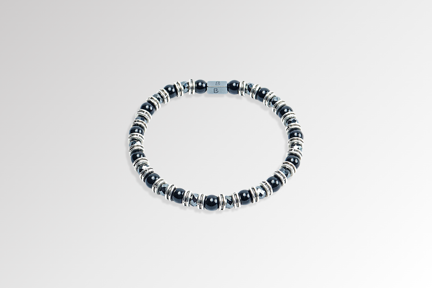 Black Onyx Bracelet by Beneka – Natural Stone Slip-On Bracelet with 6mm polished Black Onyx beads, stainless steel rings, and premium elastic silicone cord. Elegant unisex luxury wrist accessory for protection, style, and energy balance.