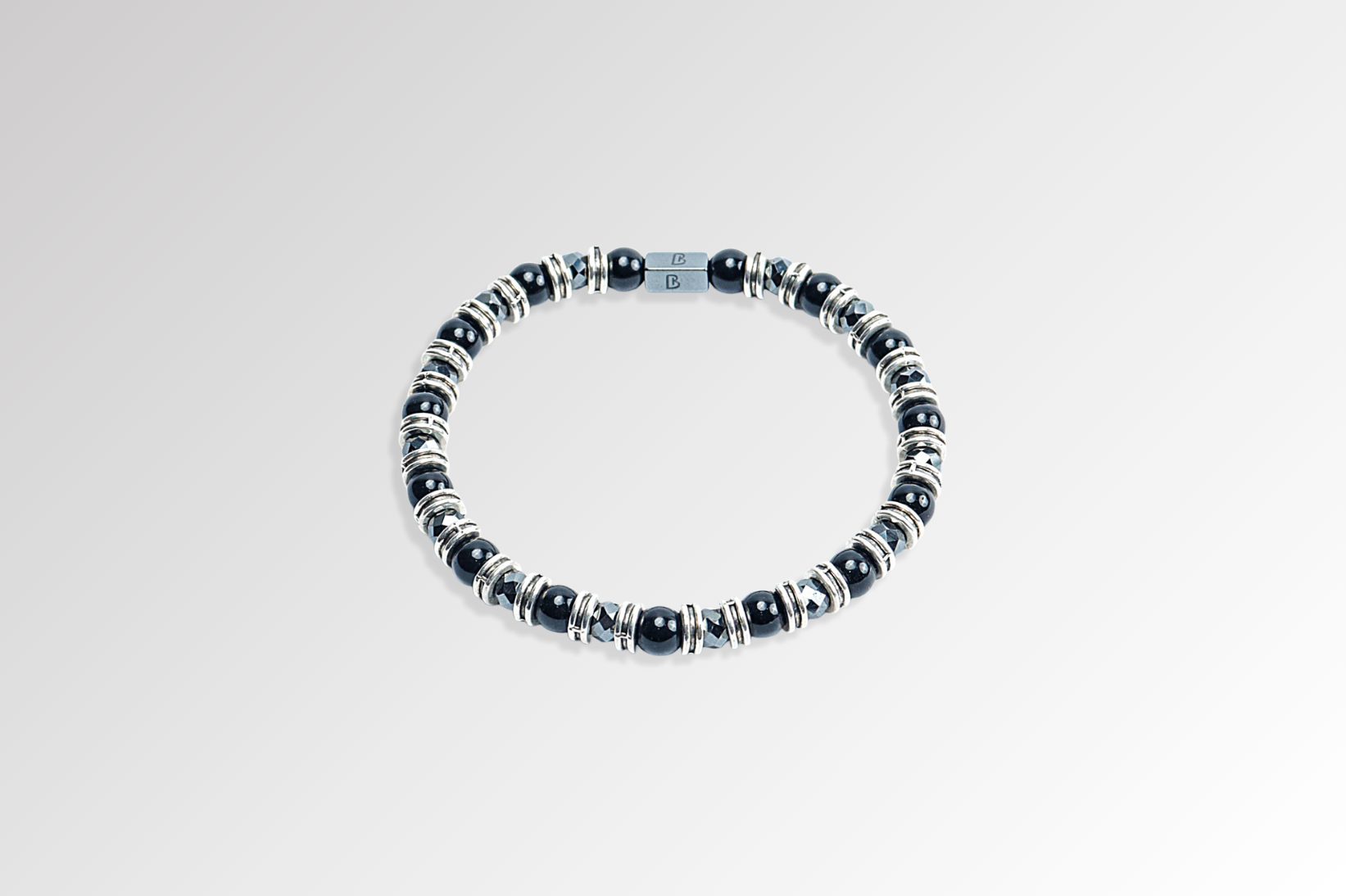 Black Onyx Bracelet by Beneka – Natural Stone Slip-On Bracelet with 6mm polished Black Onyx beads, stainless steel rings, and premium elastic silicone cord. Elegant unisex luxury wrist accessory for protection, style, and energy balance.