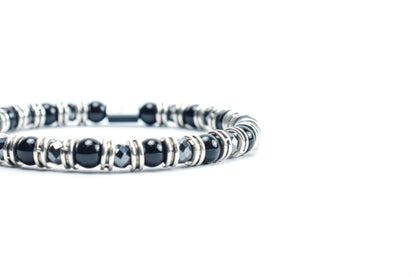 Black Onyx Bracelet by Beneka – Natural Stone Slip-On Bracelet with 6mm polished Black Onyx beads, stainless steel rings, and premium elastic silicone cord. Elegant unisex luxury wrist accessory for protection, style, and energy balance.